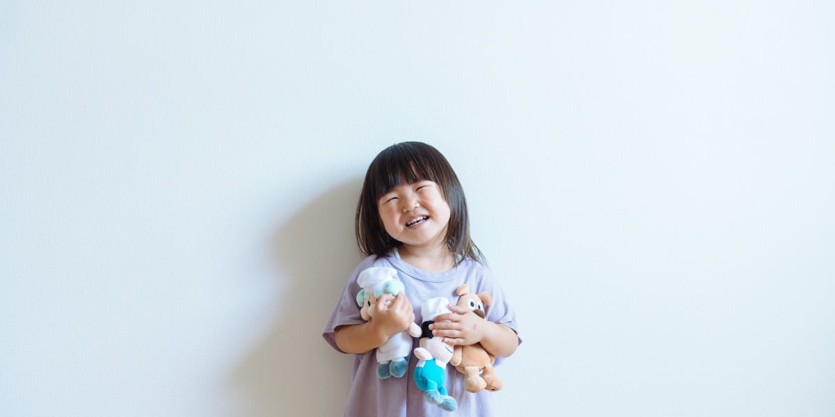 Happy child playing with toys